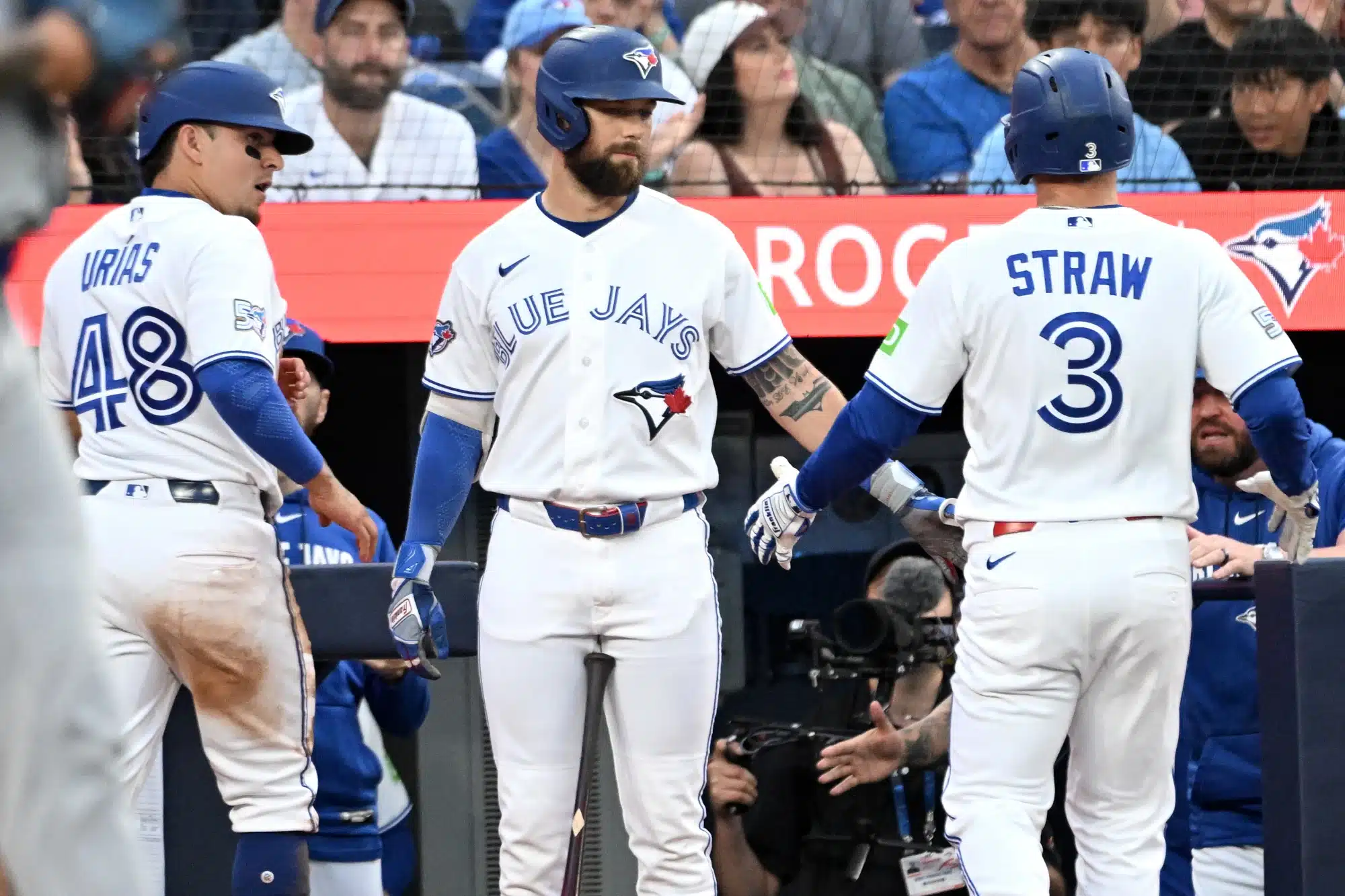 Jun 29, 2026; Toronto, Ontario, CAN; Toronto Blue Jays center fielder Myles Straw (3) is greeted by right fielder Nathan Lukes (38) after his sacrifice fly scored second baseman Luis Urias (48) against the New York Mets in the fifth inning at Rogers Centre.