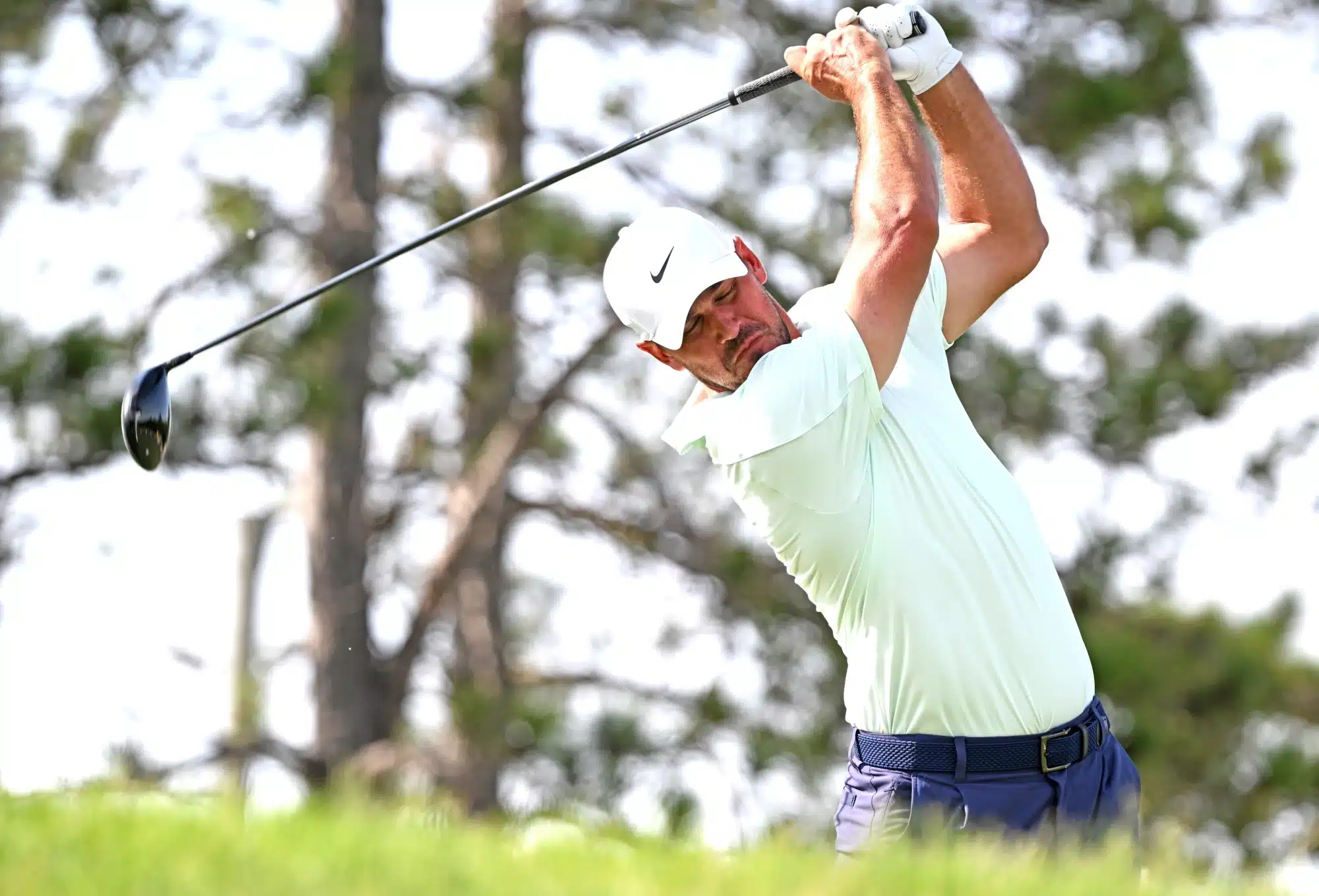 Brooks Koepka hits his tee shot at the 17th hole during the first round of the RBC Canadian Open golf tournament.  Jun 11, 2026; Caledon, Ontario, Canada.