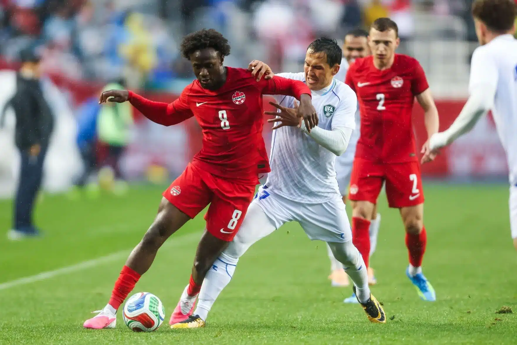Canada’s Ismael Kone, left, and Uzbekistan’s Otabek Shukurov battle for the ball during the first half of an international men’s soccer friendly in Edmonton on Monday, June 1, 2026. 