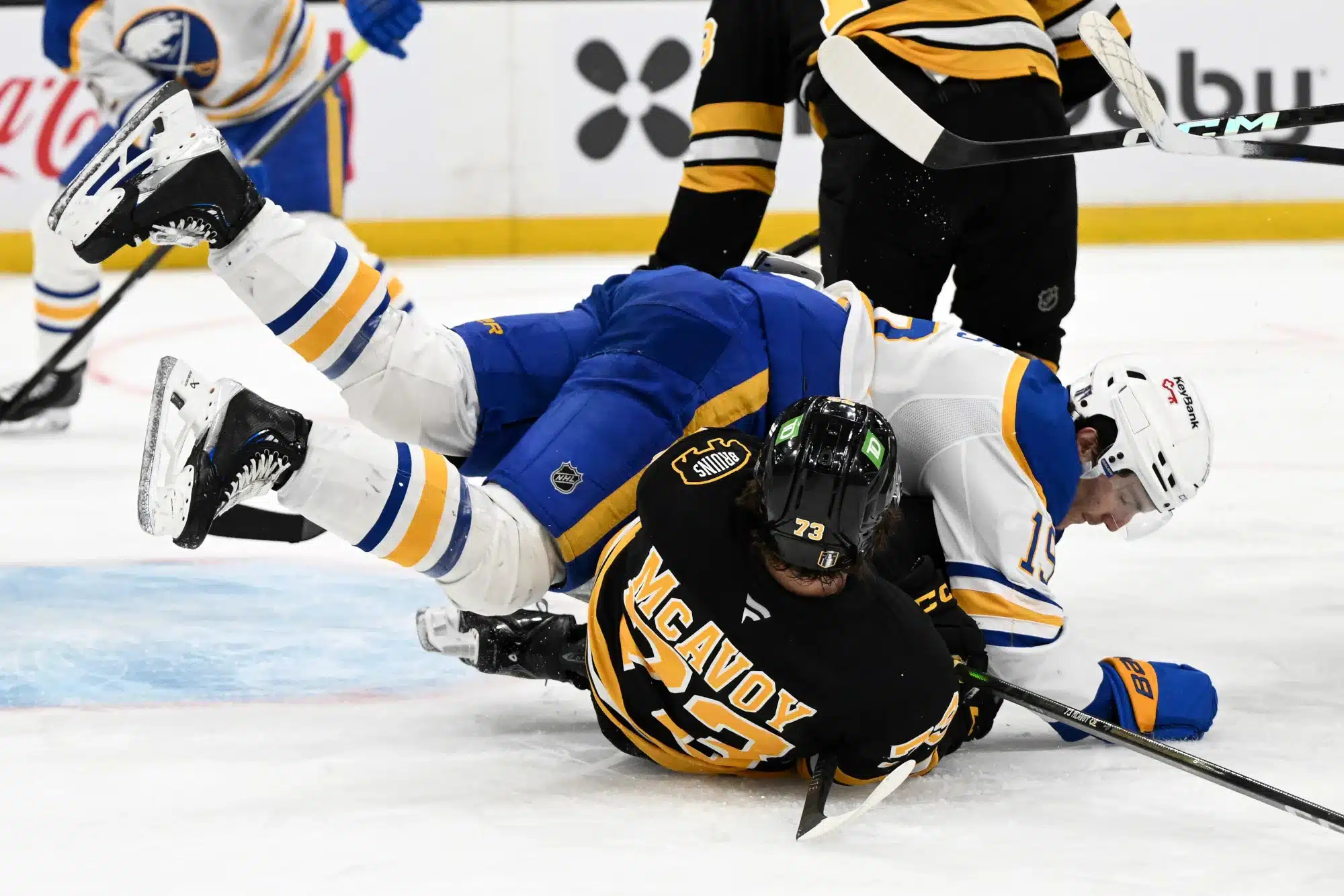 Apr 23, 2026; Boston, Massachusetts, USA; Buffalo Sabres center Peyton Krebs (19) collides with Boston Bruins defenseman Charlie McAvoy (73) during the second period of game three of the first round of the 2026 Stanley Cup Playoffs at the TD Garden.