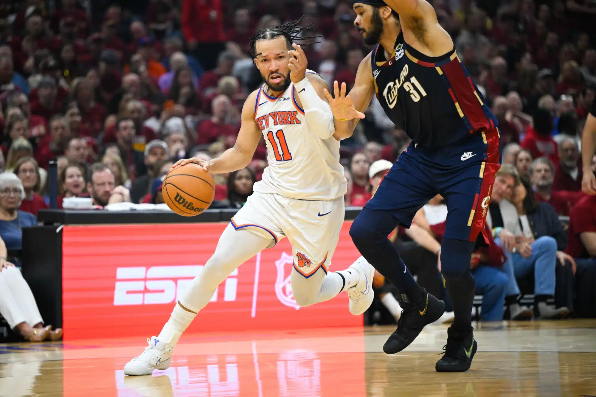 May 23, 2026; Cleveland, Ohio, USA; New York Knicks guard Jalen Brunson (11) drives the ball while defended by Cleveland Cavaliers center Jarrett Allen (31) in the third quarter during game three of the eastern conference finals for the 2026 NBA playoffs at Rocket Arena.