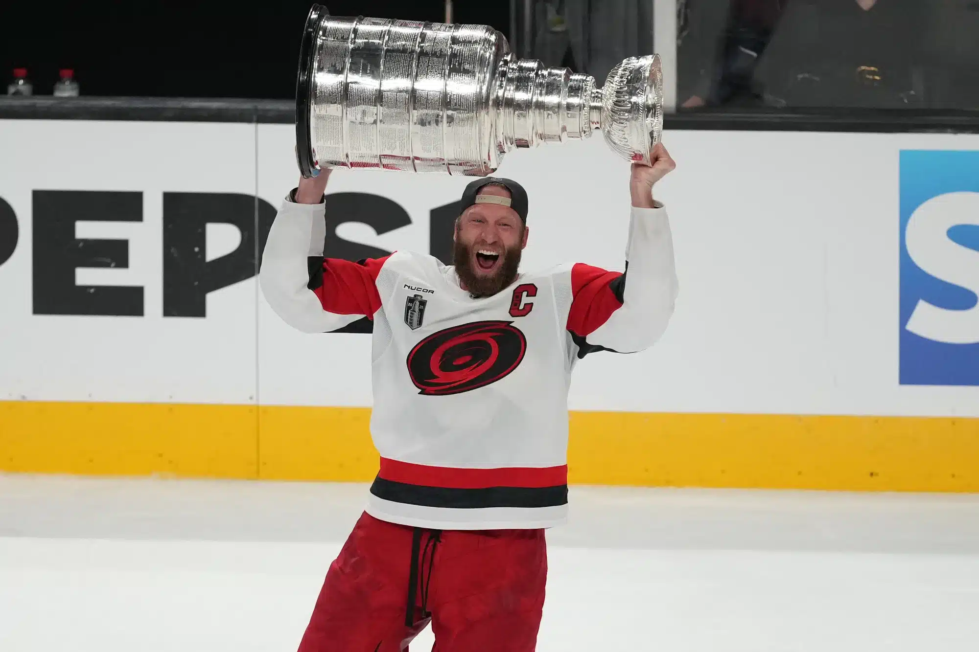 Jun 14, 2026; Las Vegas, Nevada, USA; Carolina Hurricanes center Jordan Staal (11) raises the the Stanley Cup after the win against the Vegas Golden Knights in game six of the 2026 Stanley Cup Final at T-Mobile Arena.