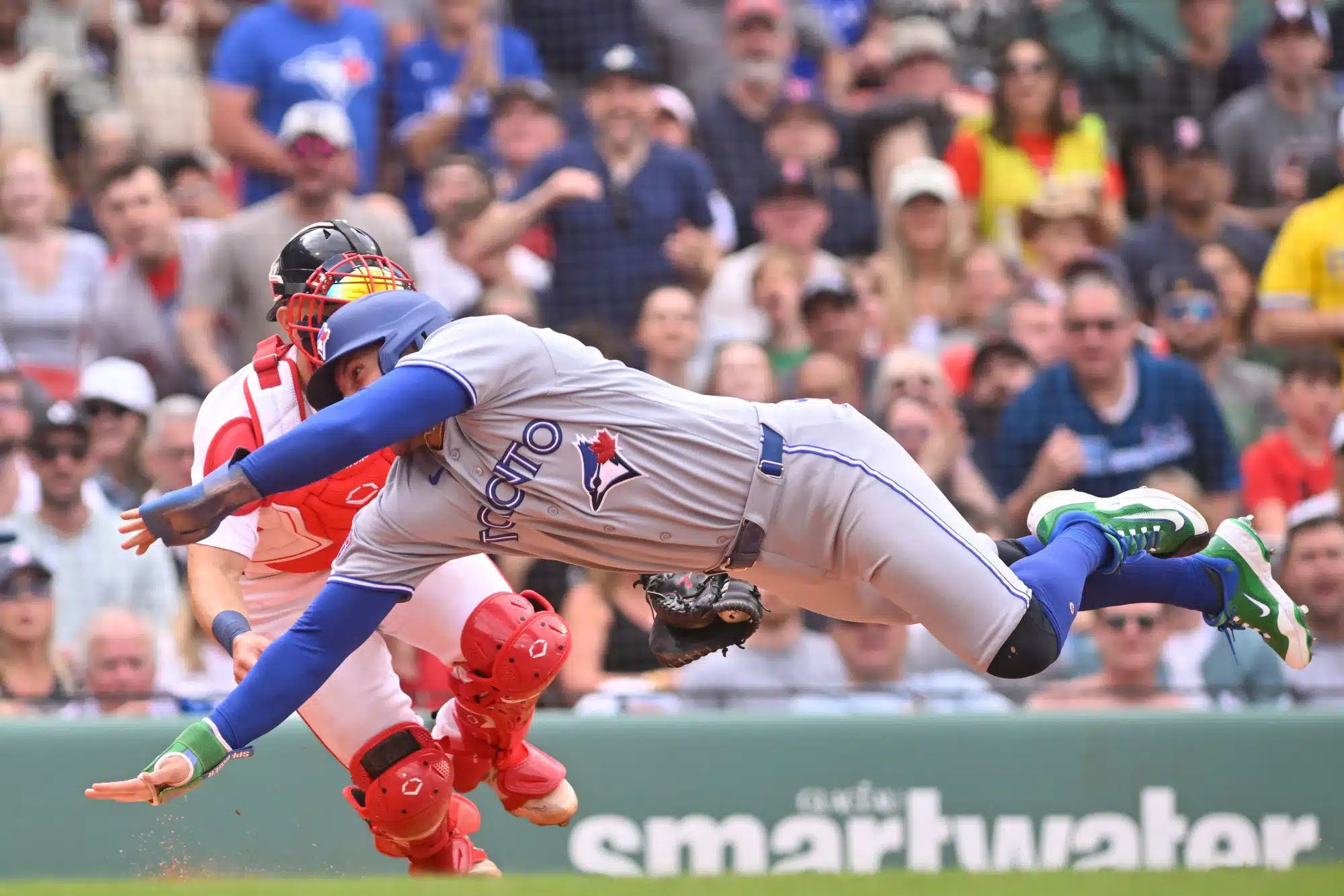 Jun 18, 2026; Boston, Massachusetts, USA; Boston Red Sox catcher Connor Wong (12) tags Toronto Blue Jays designated hitter George Springer (4) out during the eighth inning at Fenway Park.