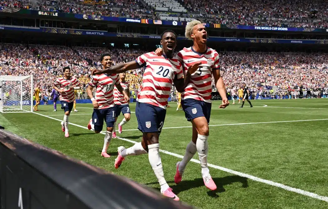 Folarin Balogun and Antonee Robinson celebrate after an own goal by Australia's Cameron Burgess put the U.S. ahead.