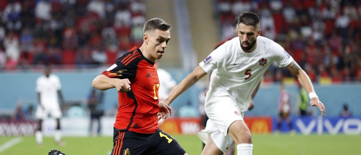 Belgium midfielder Leandro Trossard (17) dribbles in front of Canada defender Steven Vit ria (5) during the second half of a group stage match during the 2022 FIFA World Cup at Ahmad Bin Ali Stadium