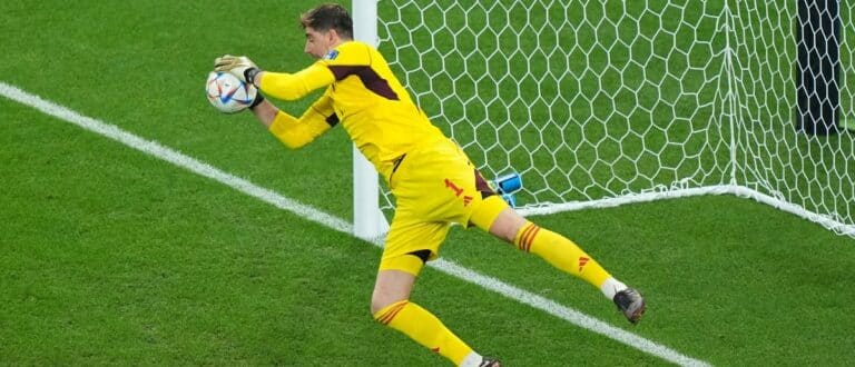 Belgium goalkeeper Thibaut Courtois (1) makes a save during the second half of a group stage match against Canada during the 2022 FIFA World Cup at Ahmad Bin Ali Stadium
