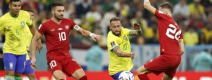 Brazil forward Neymar (10) kicks the ball past Serbia midfielder Sergej Milinkovic-Savic (20) during the second half in a group stage match during the 2022 World Cup at Lusail Stadium.