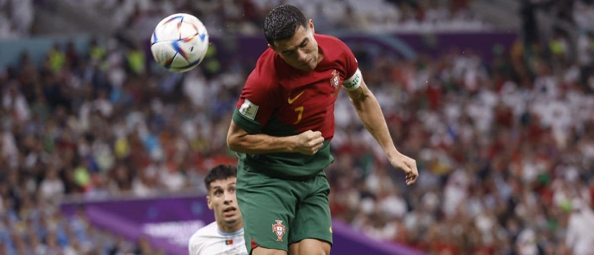 Portugal forward Cristiano Ronaldo (7) scores a goal against Uruguay during the second half of the group stage match in the 2022 World Cup at Lusail Stadium. The goal would instead be credited to midfielder Bruno Fernandes (8)