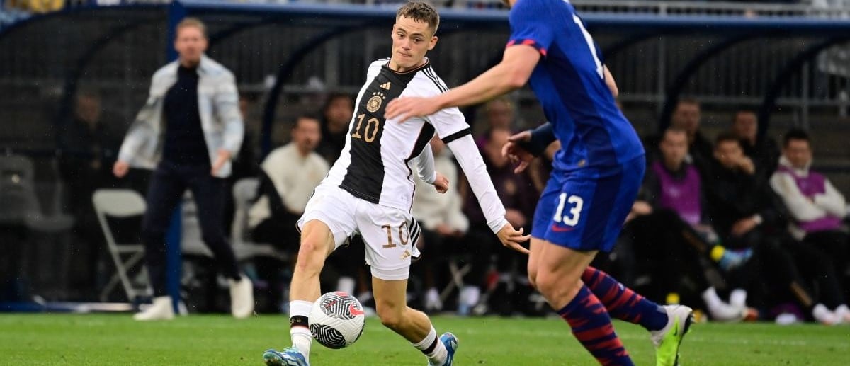 Germany midfielder Florian Wirtz (10) against United States defender Tim Ream (13) during the first half at Pratt & Whitney Stadium