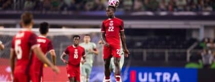Canada defender Richie Laryea (22) heads the ball against Mexico in the second half at AT&T Stadium