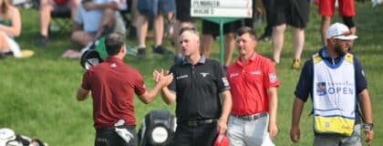 Nick Taylor (left) shakes hands with Taylor Pendrith and Mackenzie Hughes at the end of their round during the second round of the RBC Canadian Open golf tournament