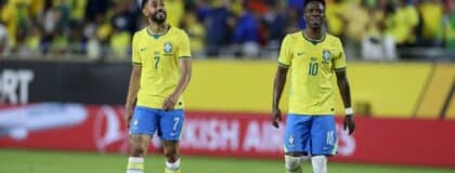Brazil forward Matheus Cunha (7) and forward Vinícius Junior (10) walk off the field after the first half during an international friendly against Croatia at Camping World Stadium