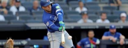 Toronto Blue Jays designated hitter George Springer (4) hits a single against the New York Yankees during the first inning at Yankee Stadium.