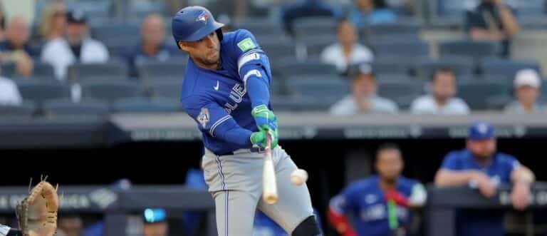 Toronto Blue Jays designated hitter George Springer (4) hits a single against the New York Yankees during the first inning at Yankee Stadium.