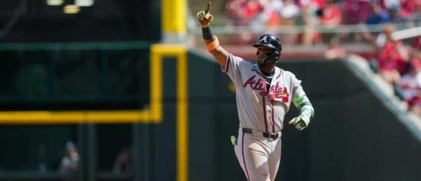 Atlanta Braves outfielder Ronald Acuna Jr. (13) gestures after hitting an RBI single against the Cincinnati Reds in the ninth inning at Great American Ball Park