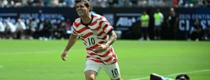 United States Christian Pulisic (10) scores as Senegal goalkeeper Mory Diaw (23) is in the background in the first half at Bank of America Stadium.