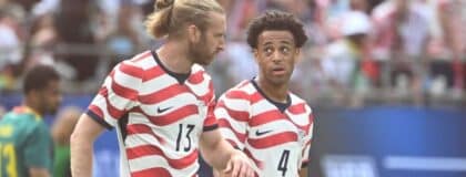 United States of America defender Tim Ream (13) with midfielder Tyler Adams (4) on the field in the first half at Bank of America Stadium
