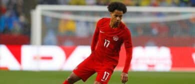Team Canada midfielder Tajon Buchanan (17) carries the ball in a game against Uzbekistan at Commonwealth Stadium