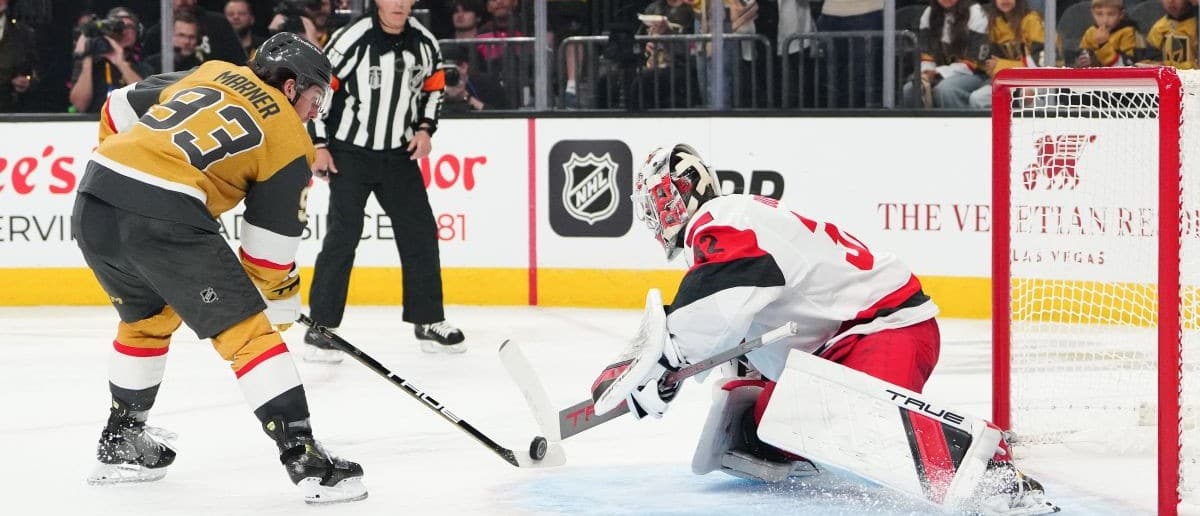 Carolina Hurricanes goaltender Brandon Bussi (32) makes a save against a penalty shot by Vegas Golden Knights right wing Mitch Marner (93) during the third period in game three of the 2026 Stanley Cup Final at T-Mobile Arena