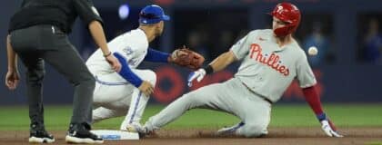 Philadelphia Phillies shortstop Trea Turner (7) slides into second base on a double against Toronto Blue Jays shortstop Andres Gimenez (0) during the first inning at Rogers Centre