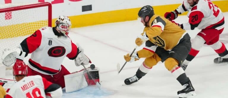 Carolina Hurricanes goaltender Brandon Bussi (32) stops a shot by Vegas Golden Knights center Jack Eichel (9) during the 3rd period in game four of the 2026 Stanley Cup Final at T-Mobile Arena
