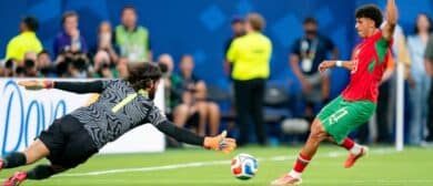 Brazil goalkeeper Alisson Becker (1) looks to block a shot by Morocco forward Ayoube Amaimouni-Echghouyab (21) during a FIFA World Cup Group C match between Brazil and Morocco at New York New Jersey Stadium on Saturday, June 13, 2026, in East Rutherford, New Jersey.