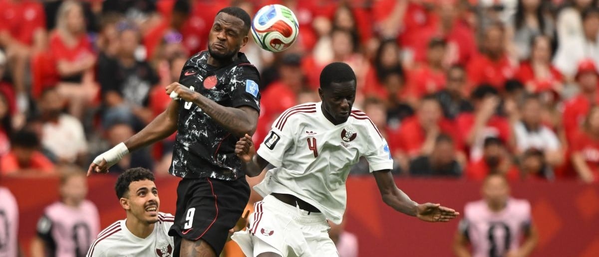 Canada forward Cyle Larin (9) goes up for a header against q4- during the second half during a Group B match in the 2026 FIFA World Cup at BC Place Vancouver.