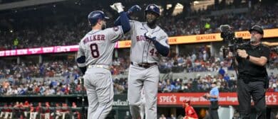 Houston Astros first baseman Christian Walker (8) and designated hitter Yordan Alvarez (44) celebrate after Alvarez hits a home run against the Texas Rangers during the sixth inning at Globe Life Field.