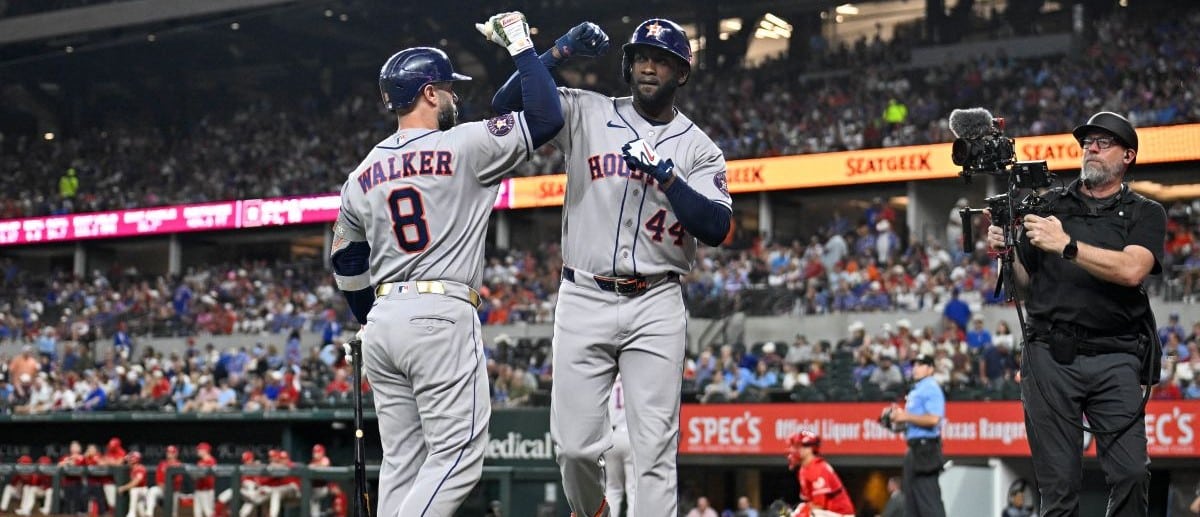 Houston Astros first baseman Christian Walker (8) and designated hitter Yordan Alvarez (44) celebrate after Alvarez hits a home run against the Texas Rangers during the sixth inning at Globe Life Field.