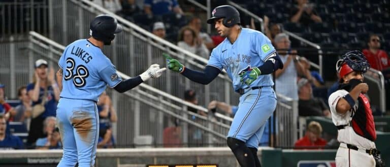 Toronto Blue Jays designated hitter George Springer (4) is congratulated by right fielder Nathan Lukes (38) after hitting a three run home run against the Washington Nationals during the eighth inning at Nationals Park.