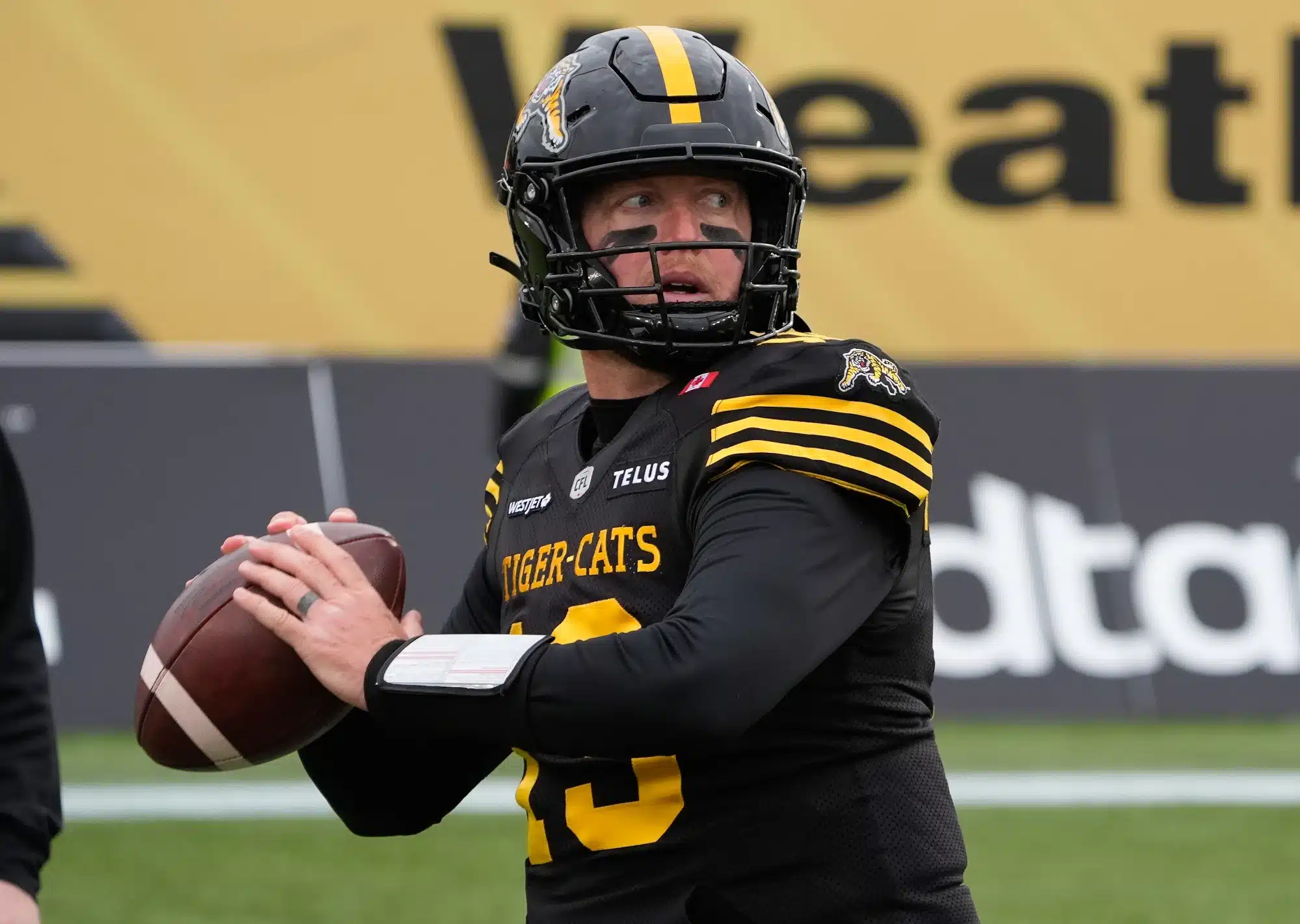Nov 8, 2025; Hamilton, Ontario, Canada; Hamilton Tiger-Cats quarterback Bo Levi Mitchell (19) throws a pass during warm up before the start of the Eastern Final against the Montreal Alouettes at Hamilton Stadium.