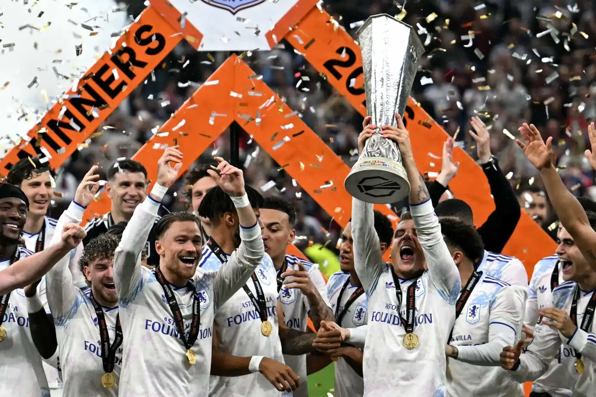 Lucas Digne of Aston Villa lifts the Europa League trophy in Istanbul after winning the final in 2026.