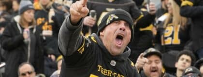 A Hamilton Tiger-Cats fan reacts after a play against the Montreal Alouettes at Hamilton Stadium