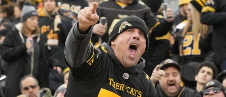 A Hamilton Tiger-Cats fan reacts after a play against the Montreal Alouettes at Hamilton Stadium