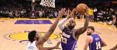 Los Angeles Lakers forward LeBron James (23) drives past Philadelphia 76ers center Joel Embiid (21) in the second half at Crypto.com Arena.