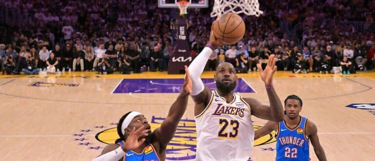 Los Angeles Lakers forward LeBron James (23) drives past Oklahoma City Thunder guard Luguentz Dort (5) during game three of the second round of the 2026 NBA Playoffs at Crypto.com Arena.