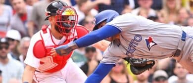 Boston Red Sox catcher Connor Wong (12) tags Toronto Blue Jays designated hitter George Springer (4) out during the eighth inning at Fenway Park