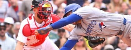 Boston Red Sox catcher Connor Wong (12) tags Toronto Blue Jays designated hitter George Springer (4) out during the eighth inning at Fenway Park