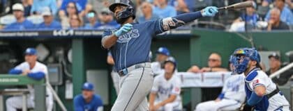 Tampa Bay Rays third baseman Junior Caminero (13) hits a two-run home run in the first inning against the Kansas City Royals at Kauffman Stadium