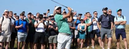Scottie Scheffler plays a shot from the rough on the third hole during a practice round for The Open Championship golf tournament at Royal Birkdale.