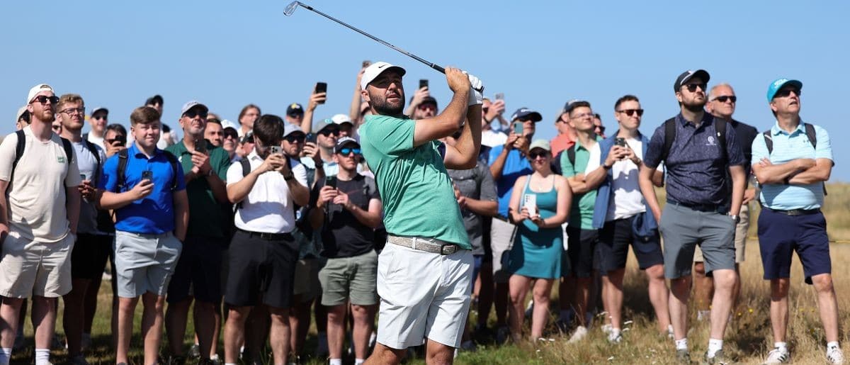 Scottie Scheffler plays a shot from the rough on the third hole during a practice round for The Open Championship golf tournament at Royal Birkdale.