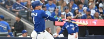 Toronto Blue Jays designated hitter George Springer (4) hits a single against the Tampa Bay Rays in the third inning at Rogers Centre.
