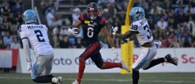 Montreal Alouettes wide receiver Tyson Philpot (6) runs with the ball and Toronto Argonauts defensive back Tarvarus McFadden (2) gives pursuit with teammate linebacker Donald Rutledge (38) during the first half at Percival-Molson stadium.