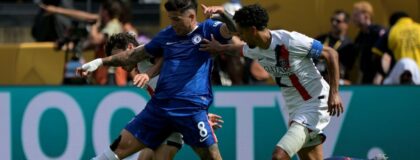 Chelsea FC midfielder Enzo Fernandez (8) kicks the ball past Paris Saint-Germain defender Marquinhos (5) during the final of the 2025 FIFA Club World Cup at MetLife Stadium.