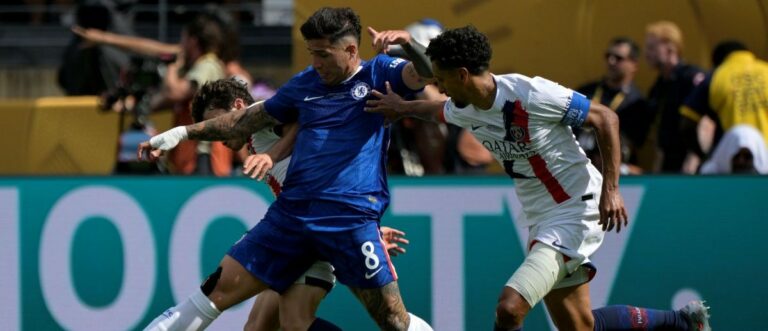 Chelsea FC midfielder Enzo Fernandez (8) kicks the ball past Paris Saint-Germain defender Marquinhos (5) during the final of the 2025 FIFA Club World Cup at MetLife Stadium.