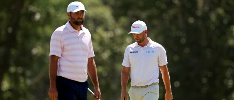 Scottie Scheffler and Wyndham Clark setup their play on the second green during the final round of the U.S. Open golf tournament at Shinnecock Hills Golf Club.