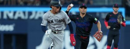 New York Yankees shortstop George Lombard (96) is chased by Toronto Blue Jays shortstop Andres Gimenez (0) against during the third inning at Rogers Centre