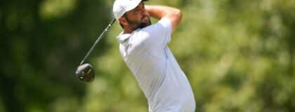 Scottie Scheffler plays his shot from the seventh tee during the third round of the FedEx St. Jude Championship golf tournament.