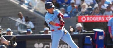 Toronto Blue Jays third baseman Kazuma Okamoto (7) hits a single against the New York Yankees during the sixth inning at Rogers Centre.