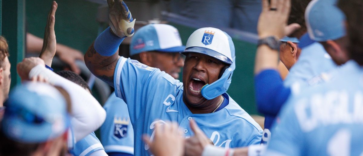 Kansas City Royals designated hitter Salvador Perez (13) celebrates in the dugout after hitting a home run during the fourth inning against the Detroit Tigers at Kauffman Stadium.